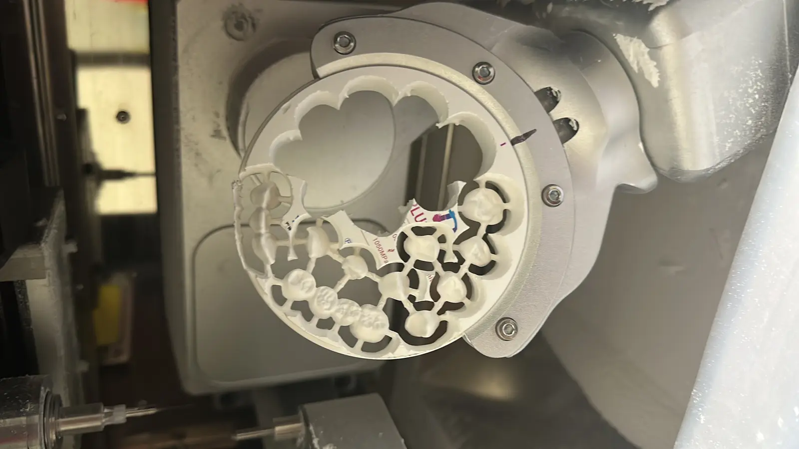 Zirconia disc with freshly milled crowns mounted on the mill