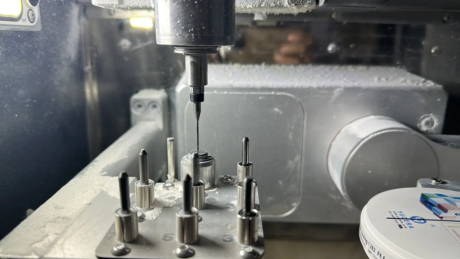 Mill spindle picking a dental milling tool