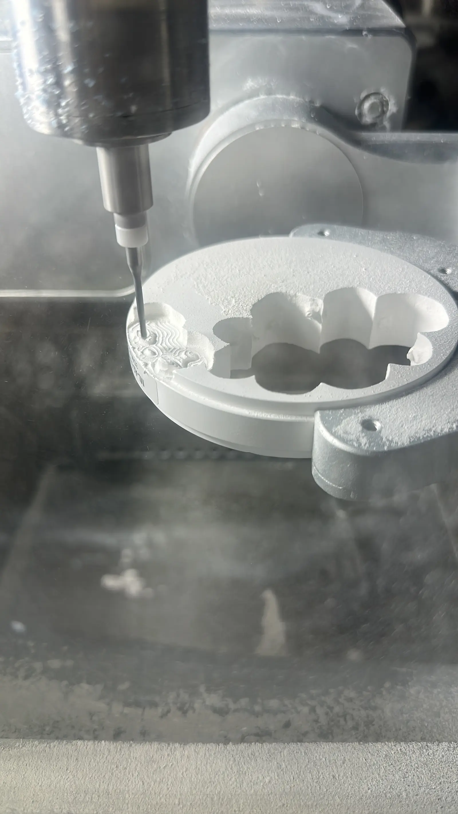 Close-up of a crown being milled in a zirconia disc